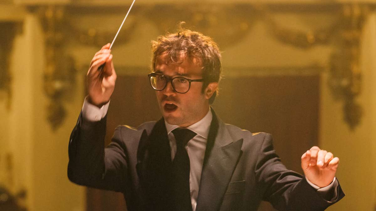Maestro conducting orchestra
